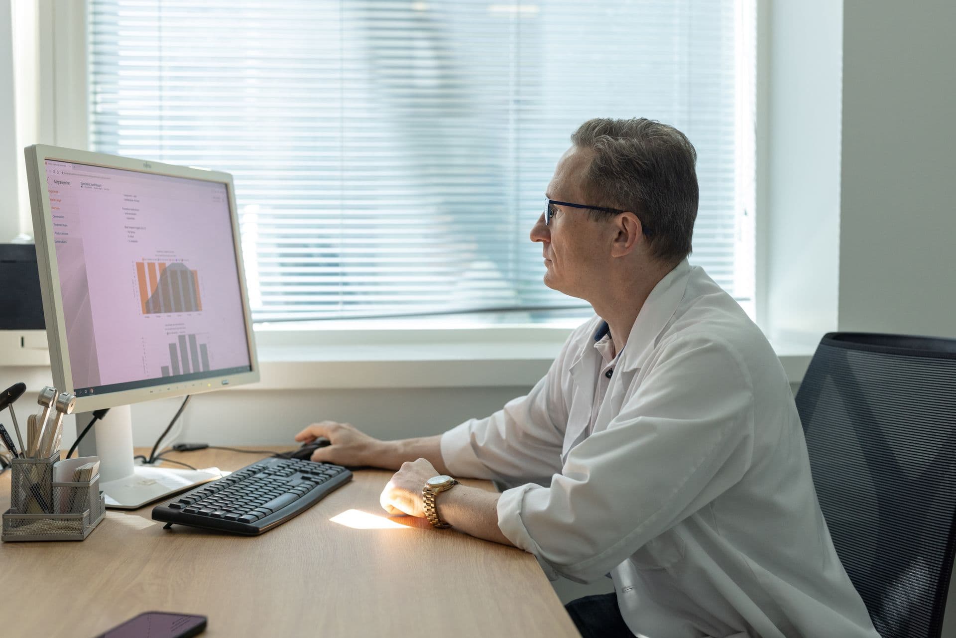 657628 Doctor Analyzing Patient Data Web Version 1920px