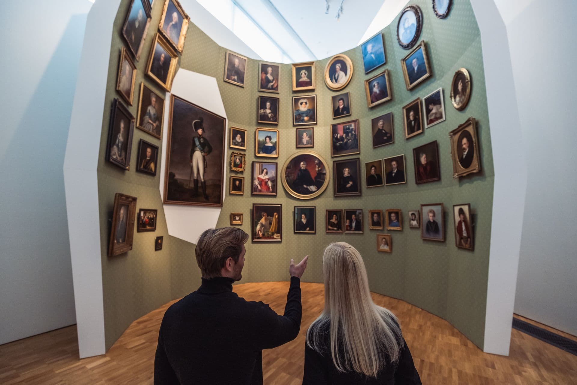 739757 Couple Viewing Portrait Wall in Museum Web Version 1920px