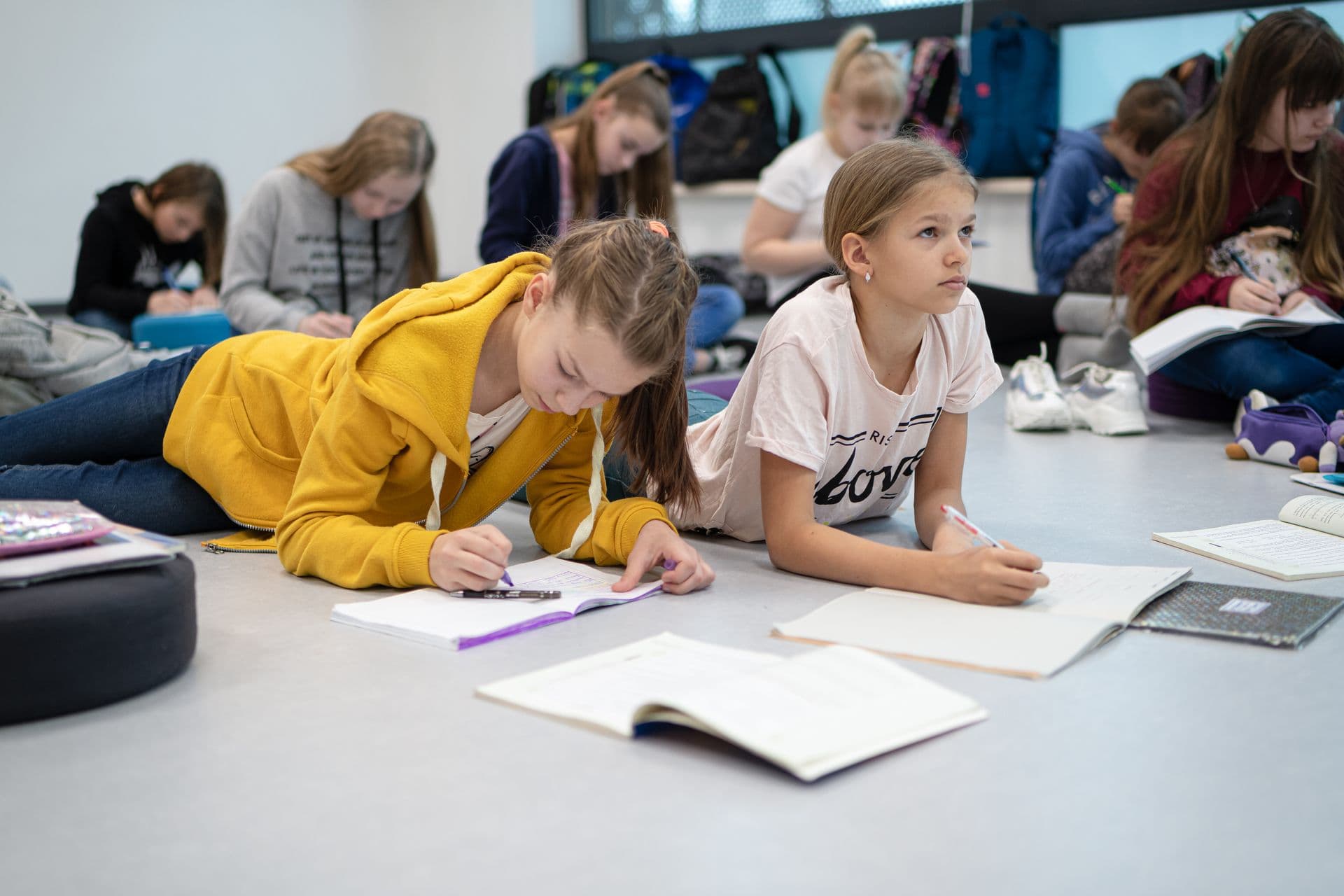 252755 Children Writing Tasks in Classroom Web Version 1920px